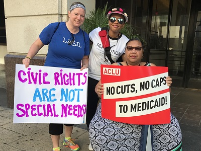 Photo - Constituents showing off their signs before the march to the Capitol.